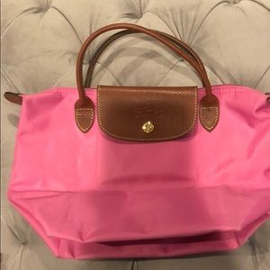 Hot pink small long champ bag.